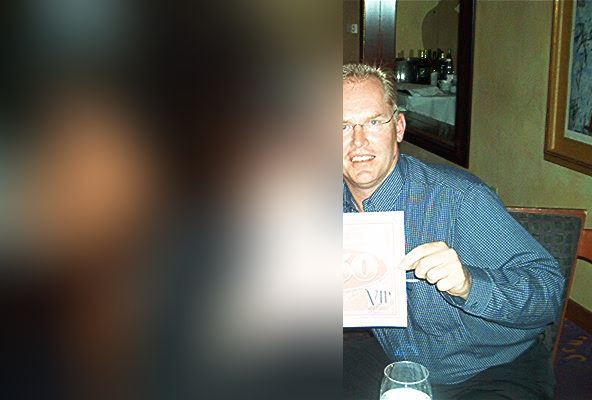Jörn at Spago in Beverly Hills holding a $750 VIP card after dinner with clients